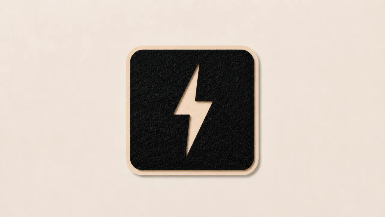 A black felt square with a cream paper lightning bolt cut out of it