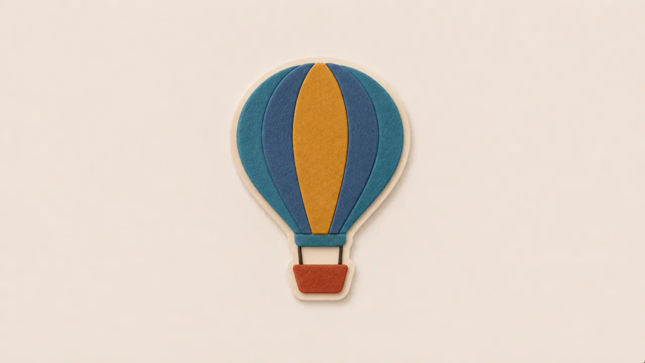 A blue and orange paper hot-air balloon with a terracotta basket